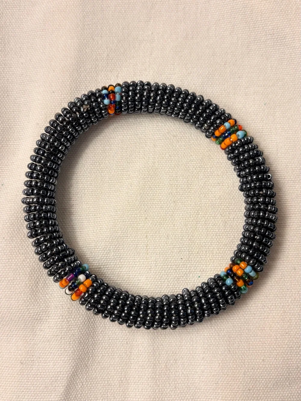 Handcrafted Hematite Beaded Bangle Bracelet with Orange Accent